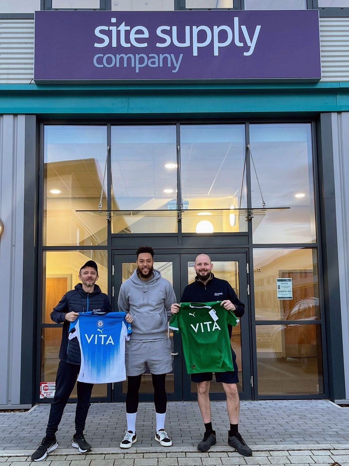 Football shirts presented outside The Site Supply Company premises as part of our Stockport County partnership