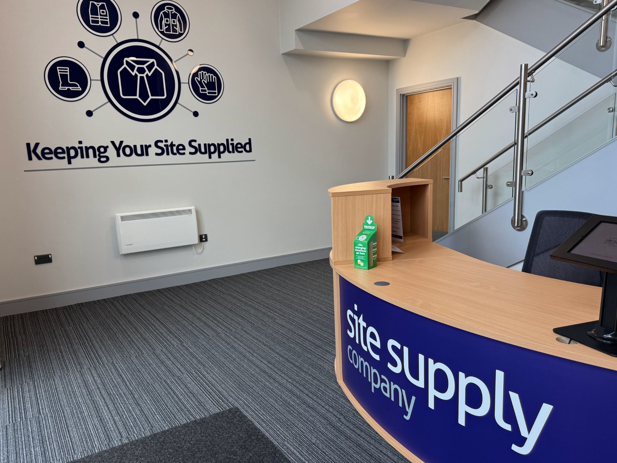 Reception at The Site Supply Company, with Keeping Your Site Supplied wall graphics